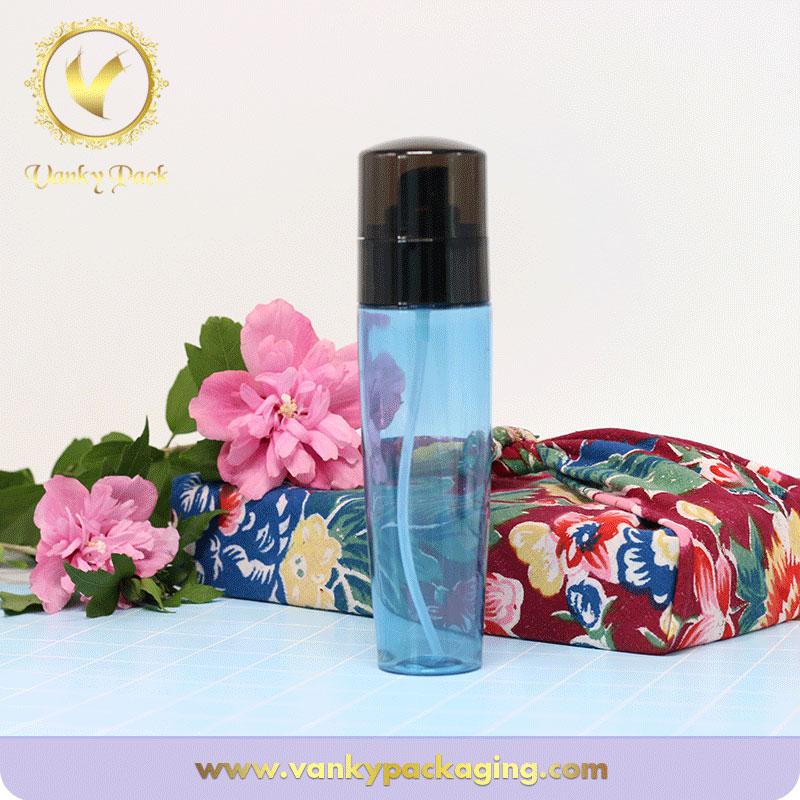 Wholesale blue transparent cosmetic PET plastic bottle with pump spray and black cap